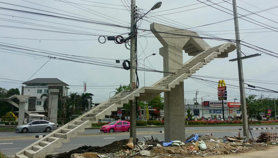 The unfinished construction of the footbridge built over an existing electricity pole on the Ratchaphruek Road in Nonthaburi province.