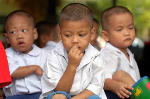 In this Monday, July 12, 2004, file photo, Thai children who are HIV positive and orphaned wait for a function to begin at the Human Development Foundation in Klong Toey slum of Bangkok, Thailand. Photo: David Longstreath / Associated Press