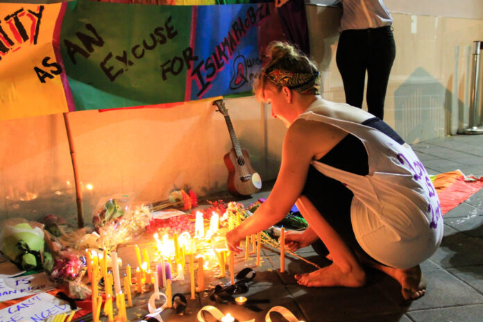 Candles were lit Monday evening in front of the U.S. Embassy in Bangkok.