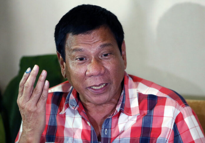 Philippines president Rodrigo Duterte, then mayor, gestures during a May 9 news conference in Davao city in the southern Philippines. Photo: Bullit Marquez / Associated Press