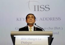 In Singapore, Prayuth Defends Social Media Crackdown