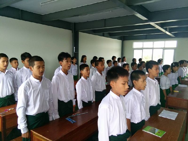 Students at a Yangon school founded by nationalist Buddhist monks began their class by singing Myanmar's national anthem on Wednesday. Photo: Mahaw Thadar High School