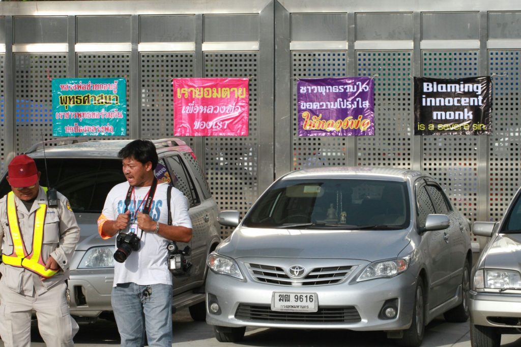 'We are willing to die for our abbot,' read one of the banners hung May 27 at Wat Dhammakaya