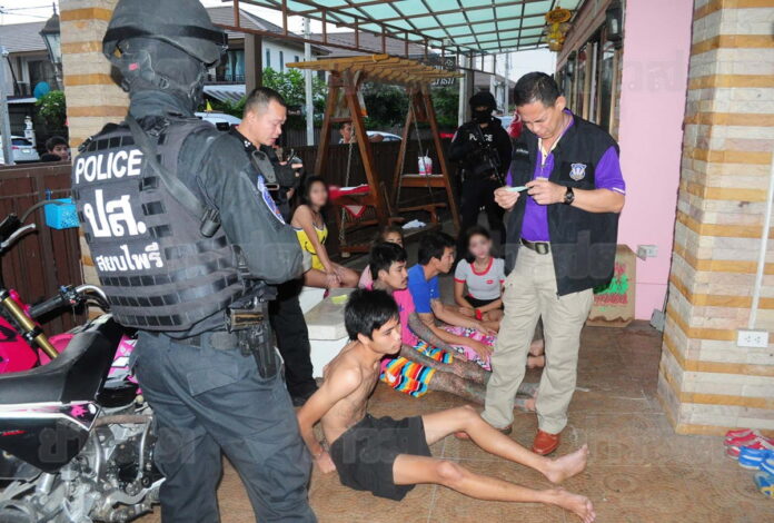 Police commandos arresting drug suspects Nov. 10 in Bangkok