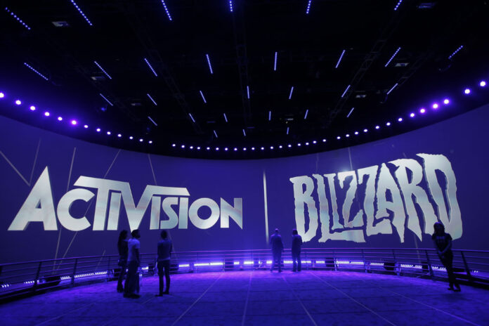 People view the Activision Blizzard Booth during the 2013 Electronic Entertainment Expo in Los Angeles. Electronic Arts and Activision are among the video game publishers angling to cut through the noise on the E3 floor by ditching their long-standing booths in favor of low-key, fan-focused events. Photo: Jae C. Hong / Associated Press