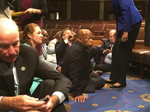 This photo provided by Rep. John Yarmuth, D-Ky., shows Democrat members of Congress, including Rep. John Lewis, D-Ga., center, and Rep. Joe Courtney, D-Conn., left, participate in sit-down protest seeking a a vote on gun control measures, Wednesday, June 22, 2016, on the floor of the House on Capitol Hill in Washington. Photo: Rep. John Yarmuth / Associated Press