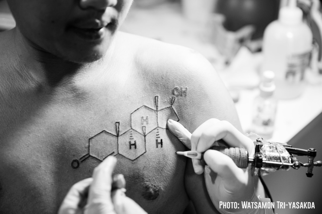 Kanattsanan 'Mukk' Dokput receives a tattoo in February representing the testosterone molecule to signify his transition to a male identity. Photo: Watsamon Tri-yasakda