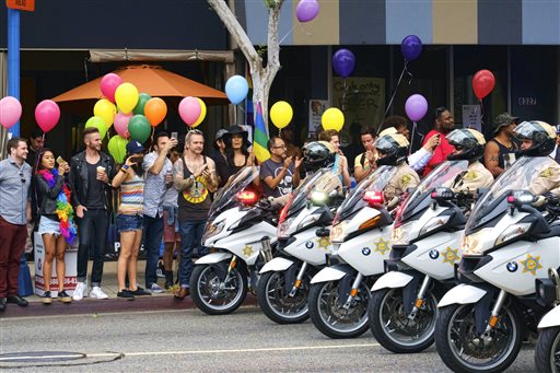 Los Angeles County Sheriff's department motorcycle deputies ride along a street in West Hollywood, Calif., during the Gay Pride Parade on Sunday, June 12, 2016. Photo: Richard Vogel / Associated Press