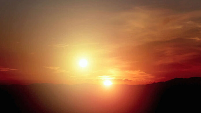 Artist's rendition of a binary star sunset as seen from a planet orbiting Kepler-16b. Image: Ames Research Center / NASA