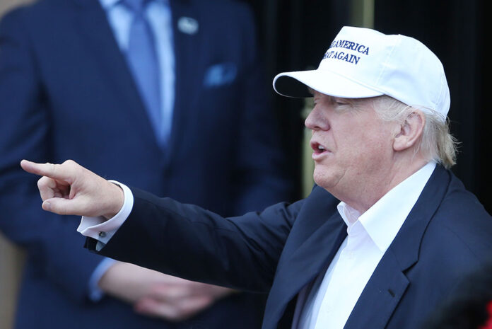 Republican presidential candidate Donald Trump speaks Friday as he arrives to his revamped Trump Turnberry golf course in Turnberry Scotland. Photo: Andrew Milligan / PA / Associated Press