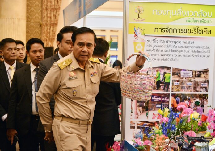 Junta chairman Prayuth Chan-ocha on Monday visits an exhibition about recycled wastes in Bangkok.