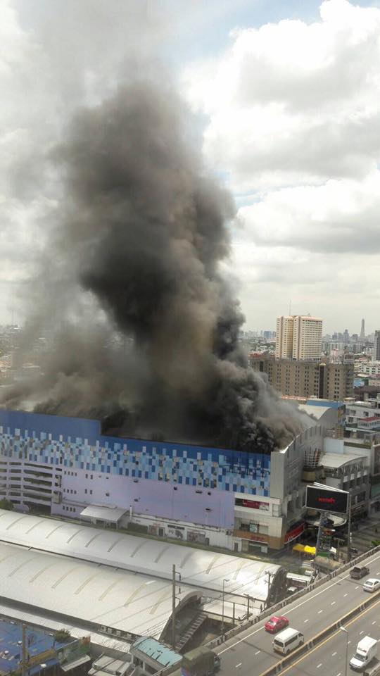 A fire burns at Major Cineplex Pinklao on Thursday morning. Photo: Spring News / Facebook