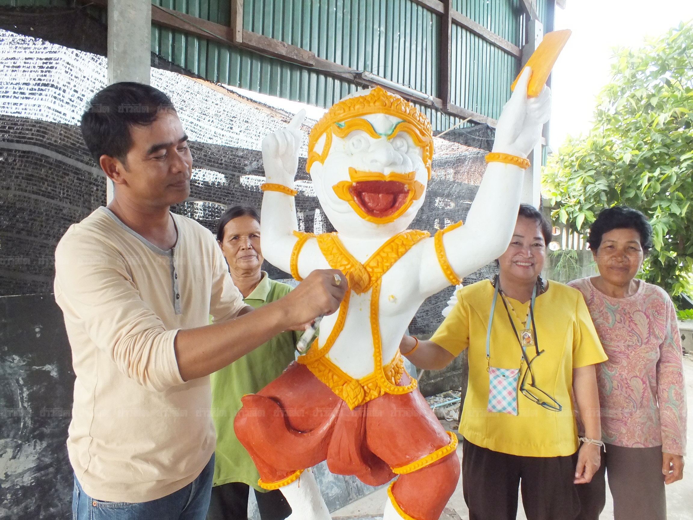 A Korat artist poses for photo on July 11, 2016, with candlewax crafted into the figure of Hanuman, the monkey god adopted by the Election Commission as its mascot for the August 2017 charter referendum. A Korat artist poses for photo on July 11, 2016, with candlewax crafted into the figure of Hanuman, the monkey god adopted by the Election Commission as its mascot for the August 2017 charter referendum.