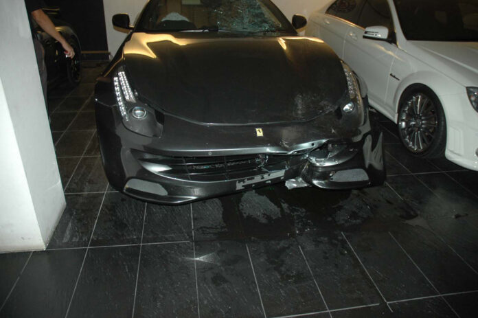 The Ferrari that killed officer Wichian Klanprasert at Vorayuth Yoovidhaya’s family home as police found it Sept. 3, 2012.