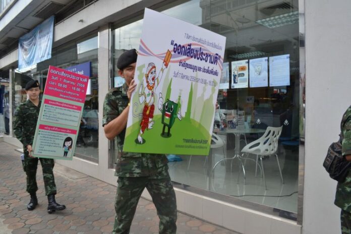 Soldiers on June 23 walk around Phitsanulok city center urging people to vote in the Aug. 7 referendum.