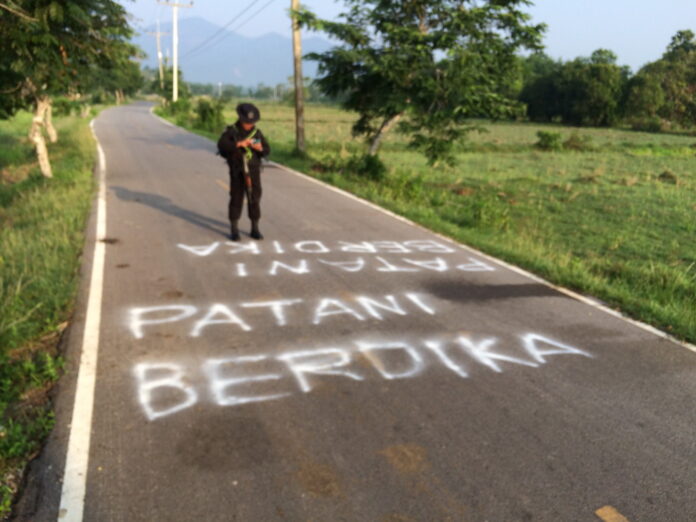 'Self-determination for Patani,' proclaims graffiti Monday on a road in Pattani province.