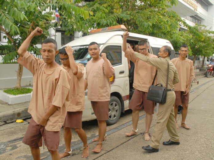 Shouting, ‘Voting no is our right, it's not illegal!’ jailed activists were escorted to a military court Tuesday morning in Bangkok.