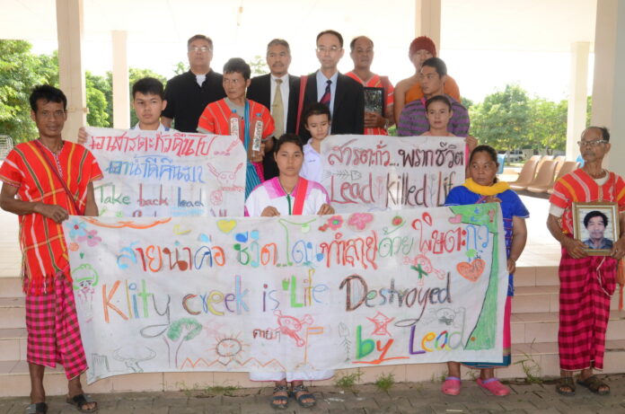 Members of the Karen community living near contaminated Klity creek Thursday in front of Kanchanaburi court.