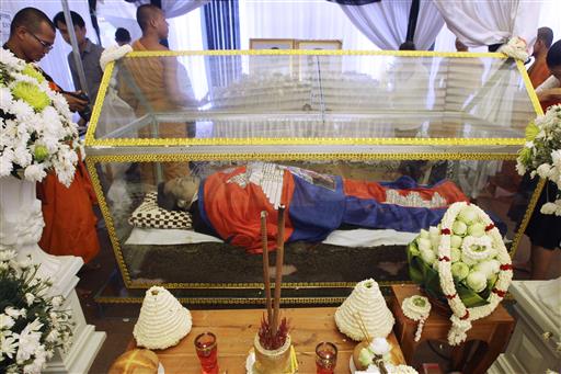 The body of Cambodian government critic Kem Ley is covered by the Cambodian National flags during a funeral ceremony, Wednesday, July 13, 2016, in Phnom Penh, Cambodia. Photo: Heng Sinith / Associated Press