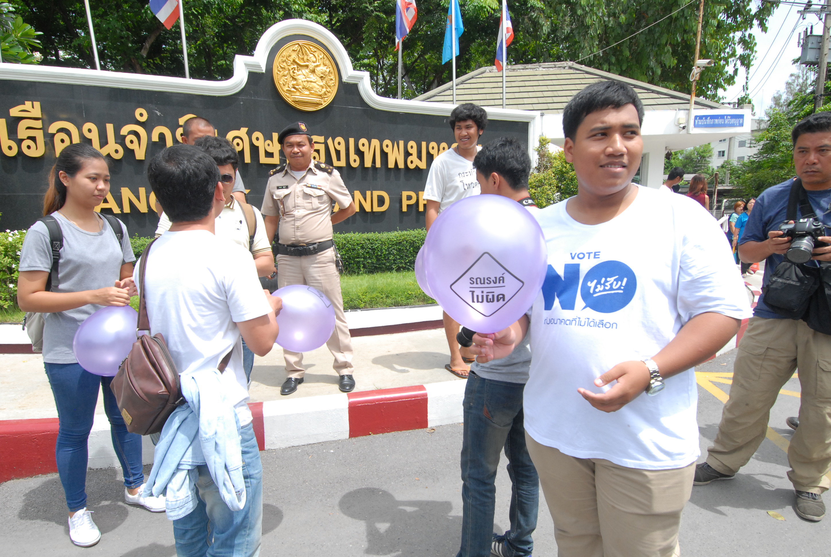 Friends of seven “Vote No” activists pose for photo on Thursday before their prison visit in front of Bangkok Remand Prison.