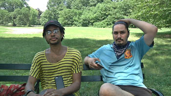 Jordan Clark, left, and Lewis Gutierrez sit in New York City's Prospect Park July 13 as they talk about their new 'Pokemon Go' business in the Brooklyn borough of New York. Photo: Ezra Kaplan / Associated Press