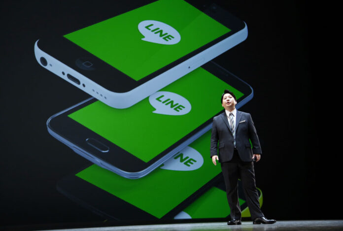 Line Corp. Chief Strategy and Marketing Officer Jun Masuda speaks at a March 24 news conference near Tokyo. Photo: Shizuo Kambayashi / Associated Press