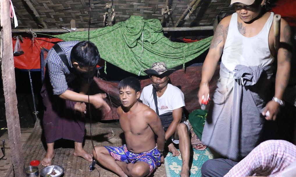 Police raid the house of Maung Maung Oo in Western Khone Thar Village near Kalay, Sagaing Region, on June 26. He was arrested earlier for drug possession, but no drugs were found in his home. Photo: Swe Win / Myanmar Now