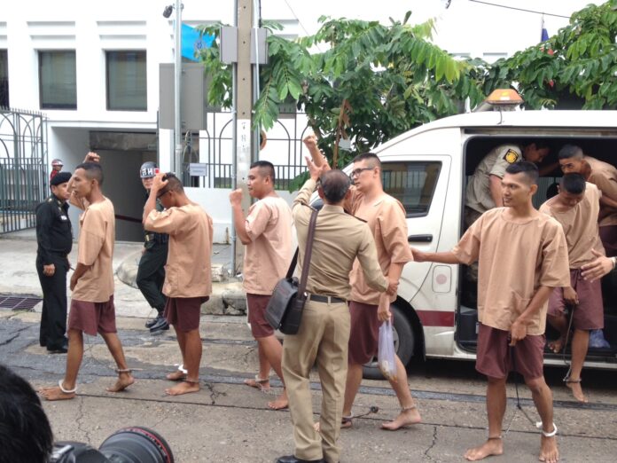 'Voting no is our right, it's not illegal!' activists opposed to the junta-backed charter referendum shout as they were brought to a military court Tuesday in Bangkok.