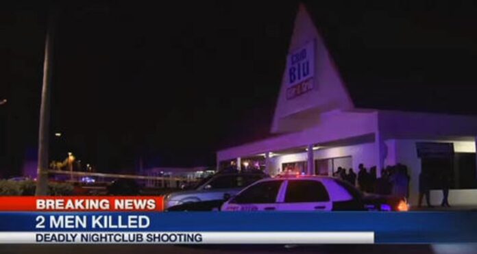 In this frame from video, people gather near the scene of a fatal shooting at Club Blu nightclub in Fort Myers, Fla., Monday, July 25, 2016. Photo: Associated Press