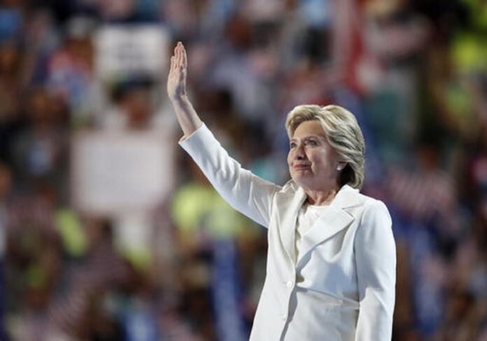 Democratic presidential nominee Hillary Clinton waves after taking the stage during the final day of the Democratic National Convention in Philadelphia , Thursday, July 28, 2016. Photo: Paul Sancya