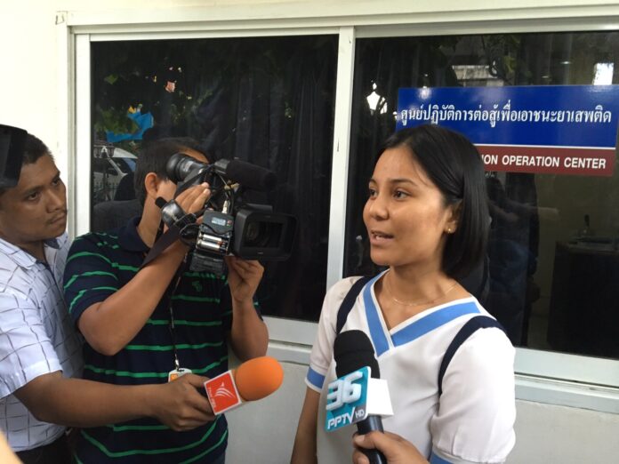 Naritsarawan Kaewnopparat speaks to reporters Tuesday in front of Bangkok's Makkasan Police Station.