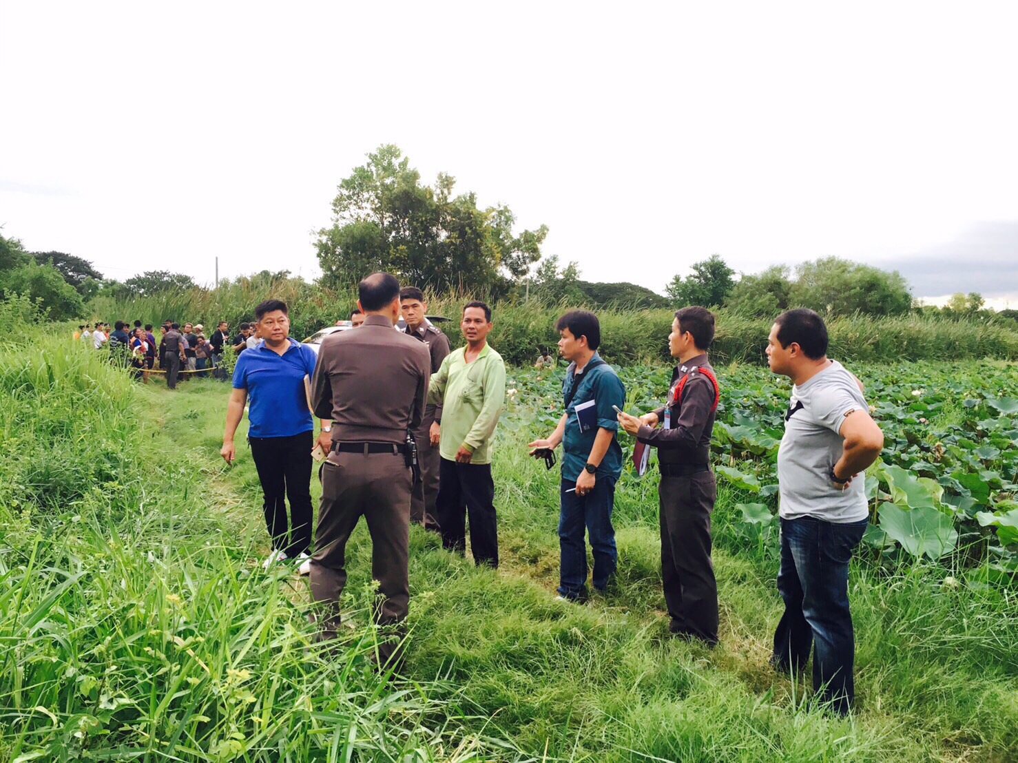 The body of Kariangsak Suttilux, 38, was found hidden in the grasses near a lotus pond in Bangkok's Min Buri district Friday.