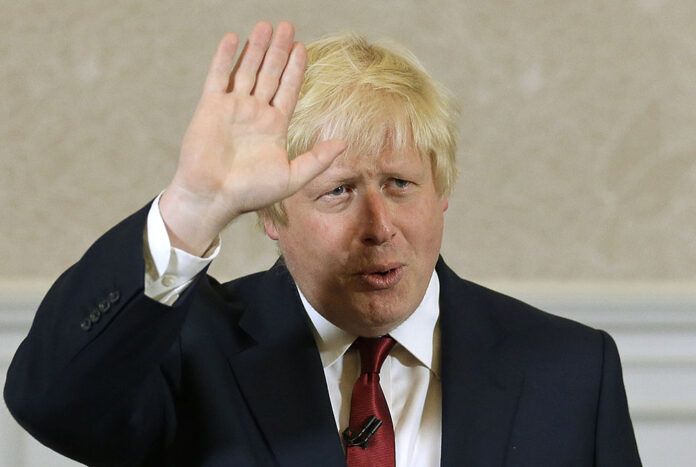 Former London mayor Boris Johnson waves after announcing Thursday he will not run for leadership of Britain's ruling Conservative Party in London. Photo:Matt Dunham / Associated Press