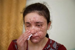 Lamiya Aji Bashar, an 18-year-old Yazidi girl who escaped her Islamic State group enslavers, talks to The Associated Press in northern Iraq in this May 5, 2016 photo.