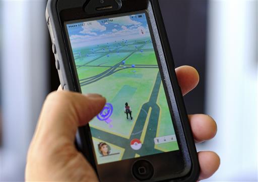 Pokemon Go is displayed on a cell phone in Los Angeles on Friday, July 8, 2016. Photo: Richard Vogel / Associated Press