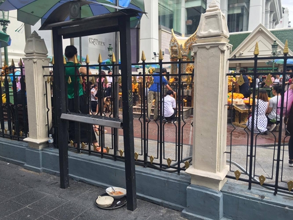 A sign outside the Erawan Shrine remains empty a year after the attack, as seen Sunday.