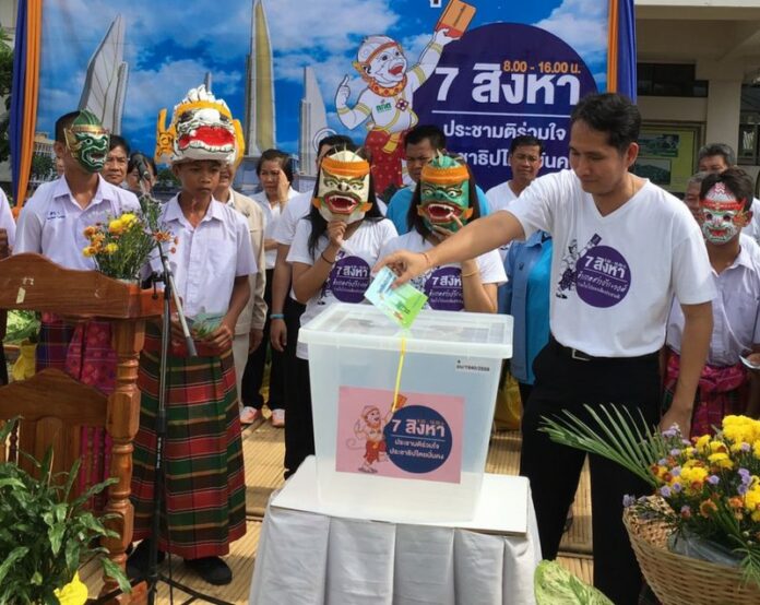 Election Commission staff demonstrate casting ballots for the August 2016 referendum at a school in Ubon Ratchathani province.