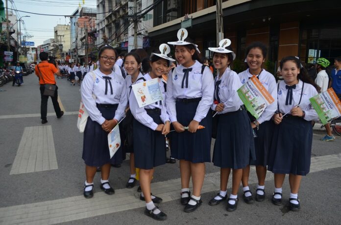 Students pose during a get-out-the-vote campaign Thursday organized by local officials in Korat.