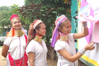 Three hill tribe women vote Sunday in Mae Hong Son province.