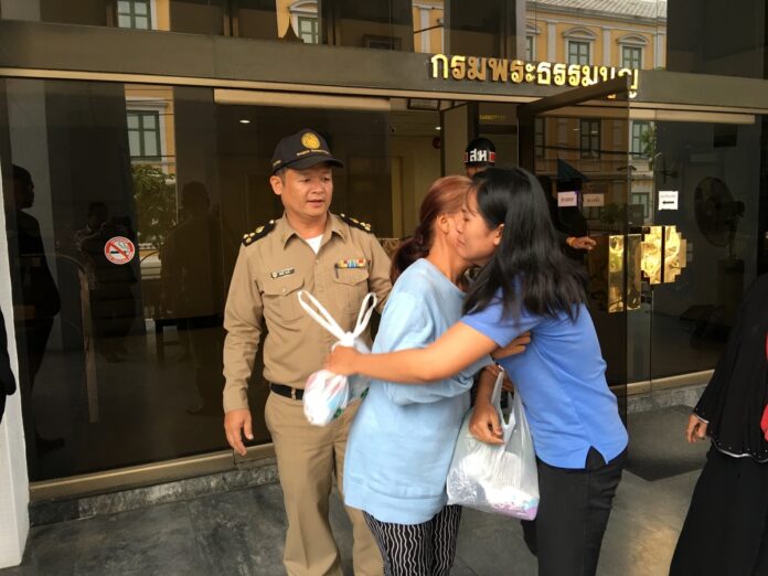 One of the alleged militants on Friday gave a hug to her supporter in front of a Bangkok military court.