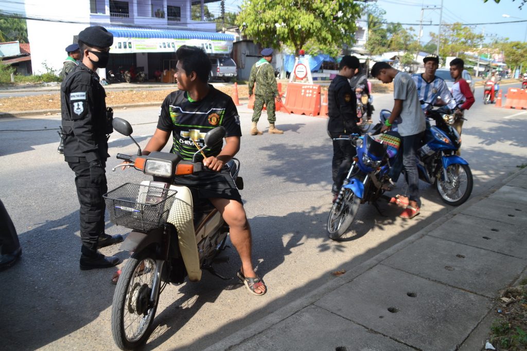 Security officers on Wednesday stop and search vehicles on a road in Yala province.
