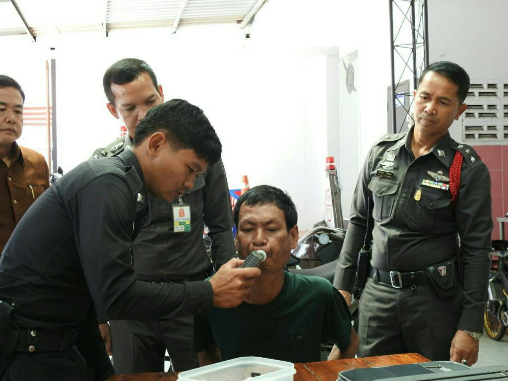  Sombat Boonsalee is given a breathalyzer test.
