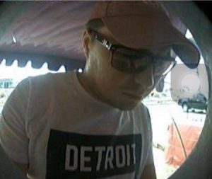 An ATM camera purportedly shows Russian suspect Rustam Shambasov withdrawing money in July in Phuket.