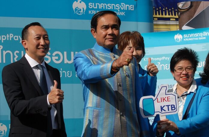 Prime Minister Prayuth Chan-ocha promotes the junta-backed Prompt Pay system Tuesday at Government House in Bangkok.