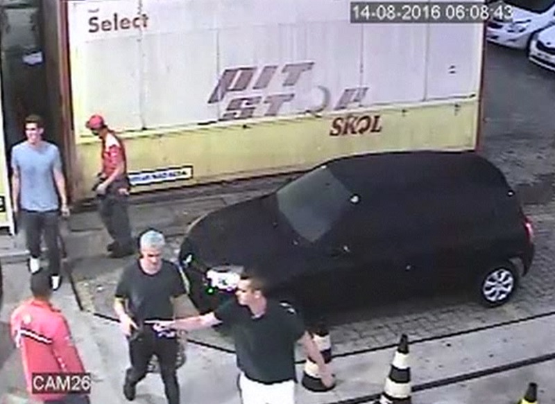 In this Sunday frame from surveillance video released by Brazil Police, swimmer Ryan Lochte, second from right, of the United States, and teammates, appear at a gas station during the 2016 Summer Olympics in Rio de Janeiro, Brazil. A top Brazil police official said the swimmers damaged property at the gas station. Photo: AP 