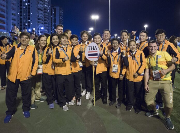 Thailand’s Olympic delegation pose Aug. 5 before the opening ceremony of the 2016 Summer Olympics in Rio.