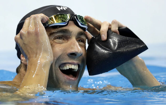 American Michael Phelps reacts after losing the men's 100-meter butterfly final at the 2016 Summer Olympics on Friday in Rio. Photo: Michael Sohn / Associated Press