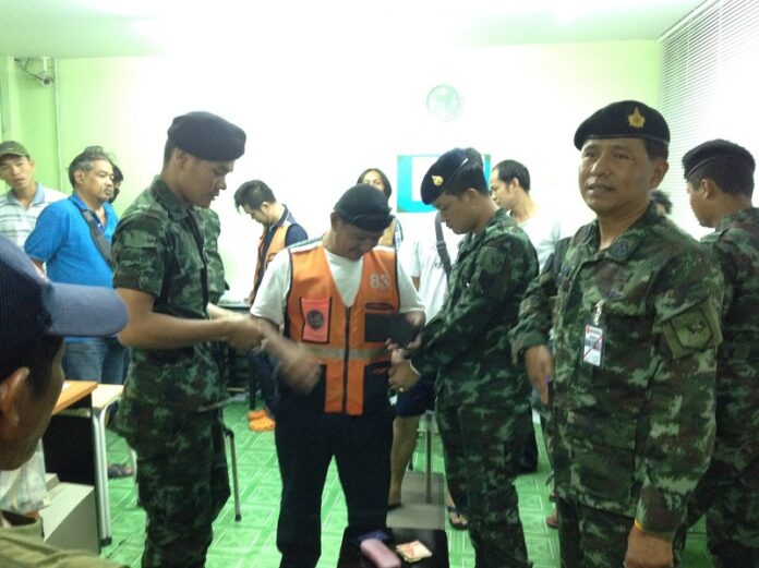Military officers raid an underground betting parlor Sunday night in Bangkok’s Phra Khanong district.