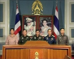 Gen. Sonthi sits at center in the first televised speech by the junta after it staged the 2006 coup.