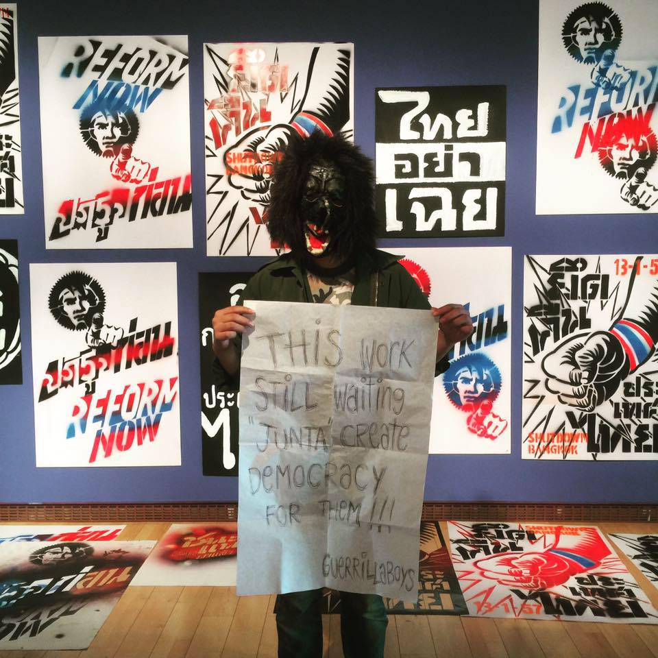 One of the Guerrilla Boys poses in front of Sutee Kunavichayanont’s ‘Thai Uprising’ on May 25 at the Gwangju Museum of Art. Photo: Guerrilla Boys / Instagram 